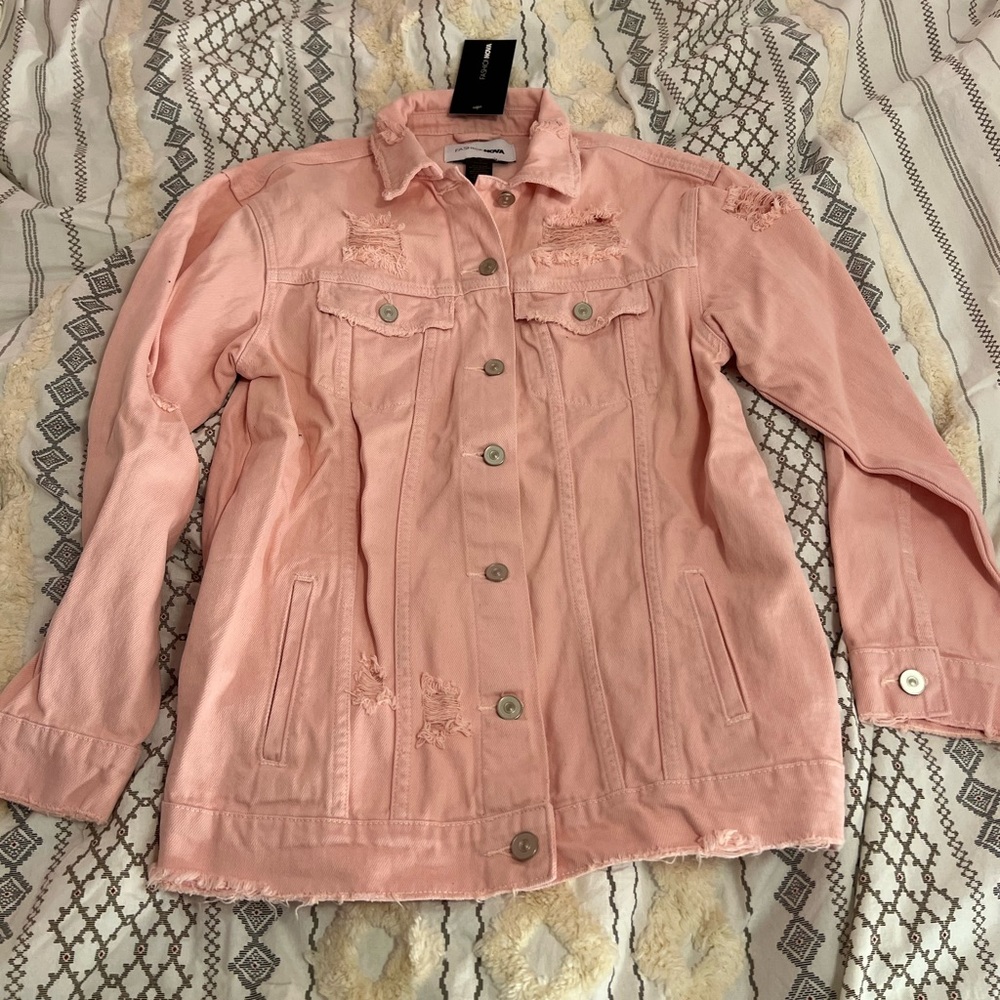 Fashion Nova Size SMALL Light pink Distressed jean jacket never worn.